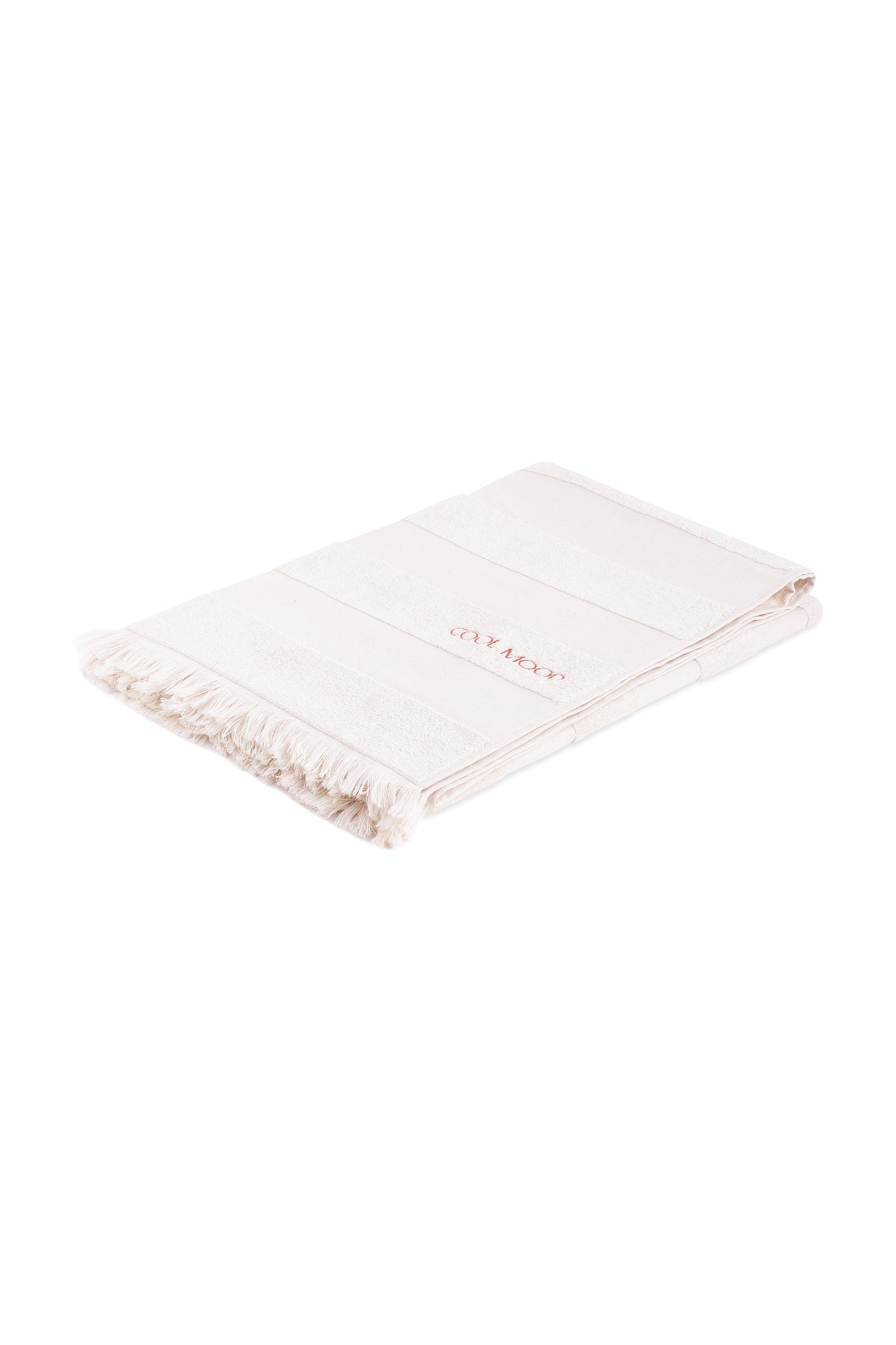 Beach towel in natural shade, with soft terry stripes, eyelash fringing detail and embroidery in rust.