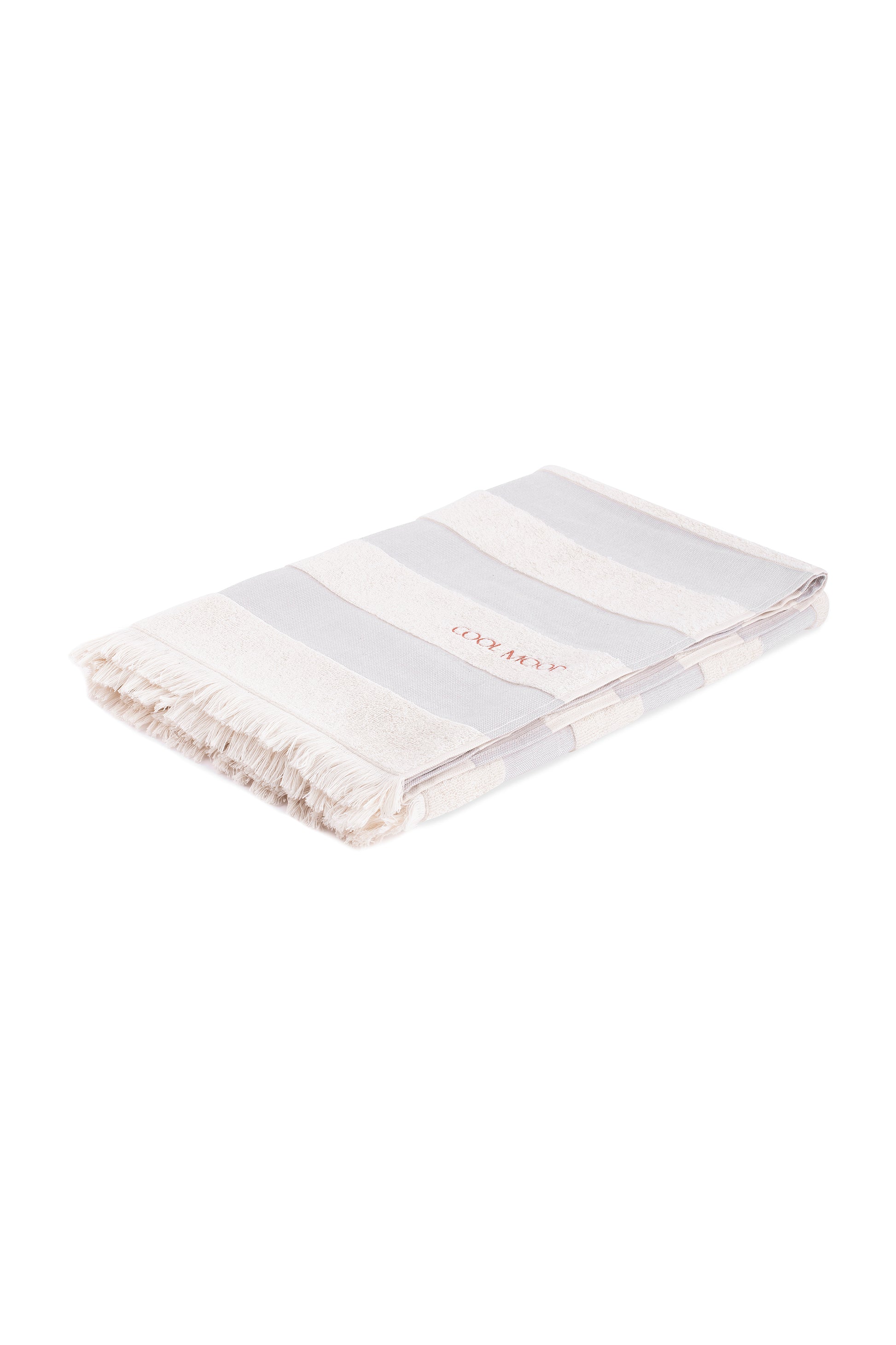Beach towel in grey shade, with soft terry stripes, eyelash fringing detail and embroidery in rust